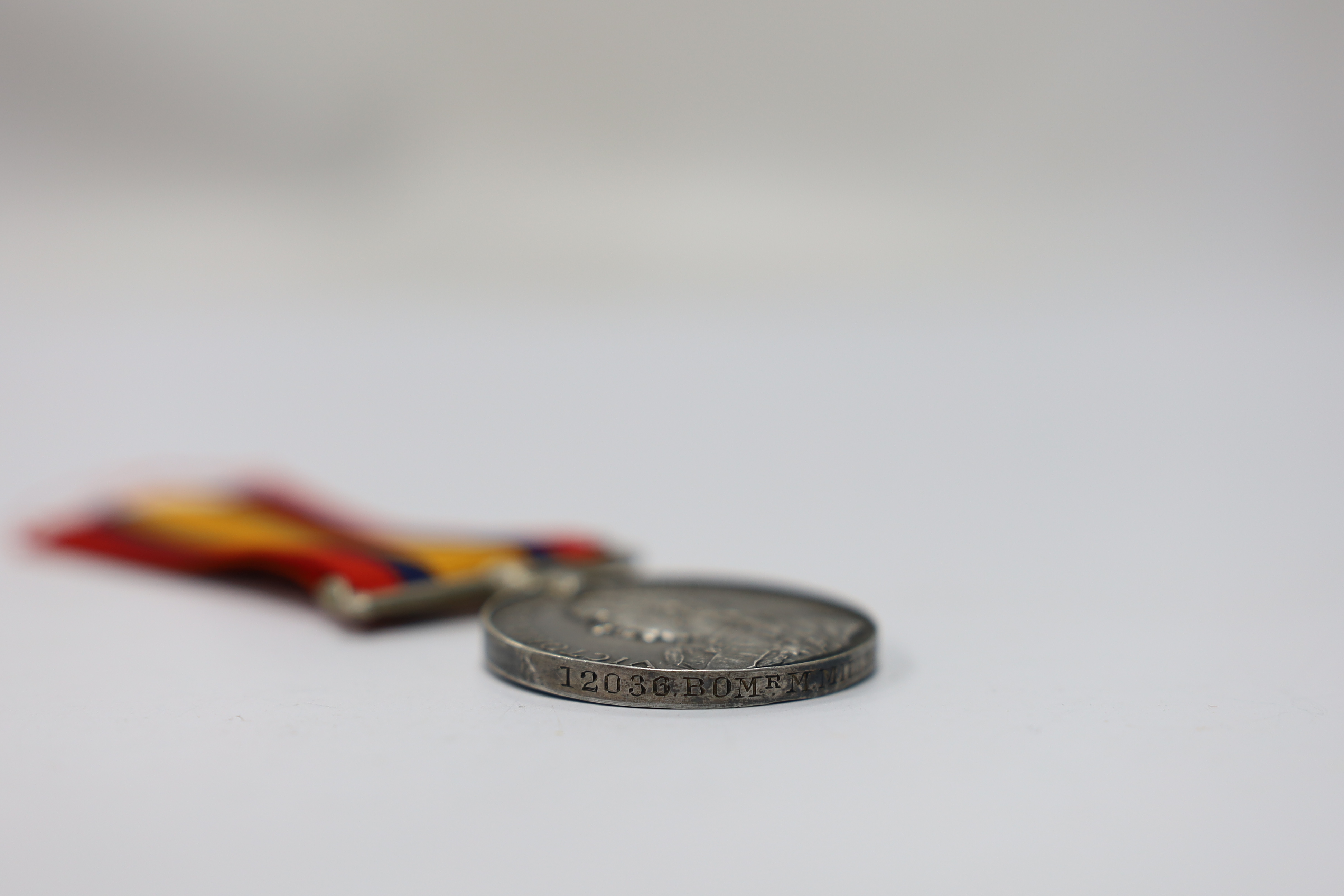 Assorted medals; two replica British North Borneo medals; Balaklava medallion; bronze GV medal; German China Campaign medal; bronze NRA medallion, unnamed